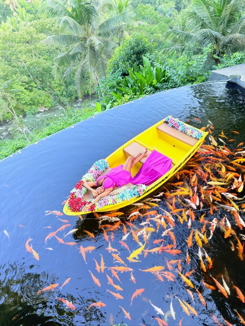 Traditional boat ride on a Bali koi pond