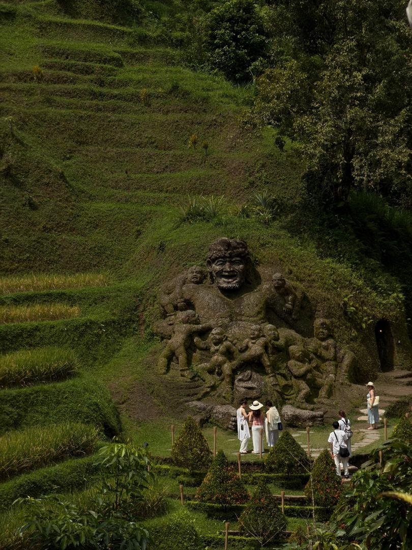 Bali temple water garden with thatched hut