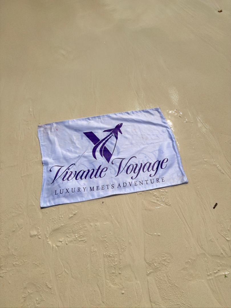 Vivante Voyage flag on a Zanzibar beach